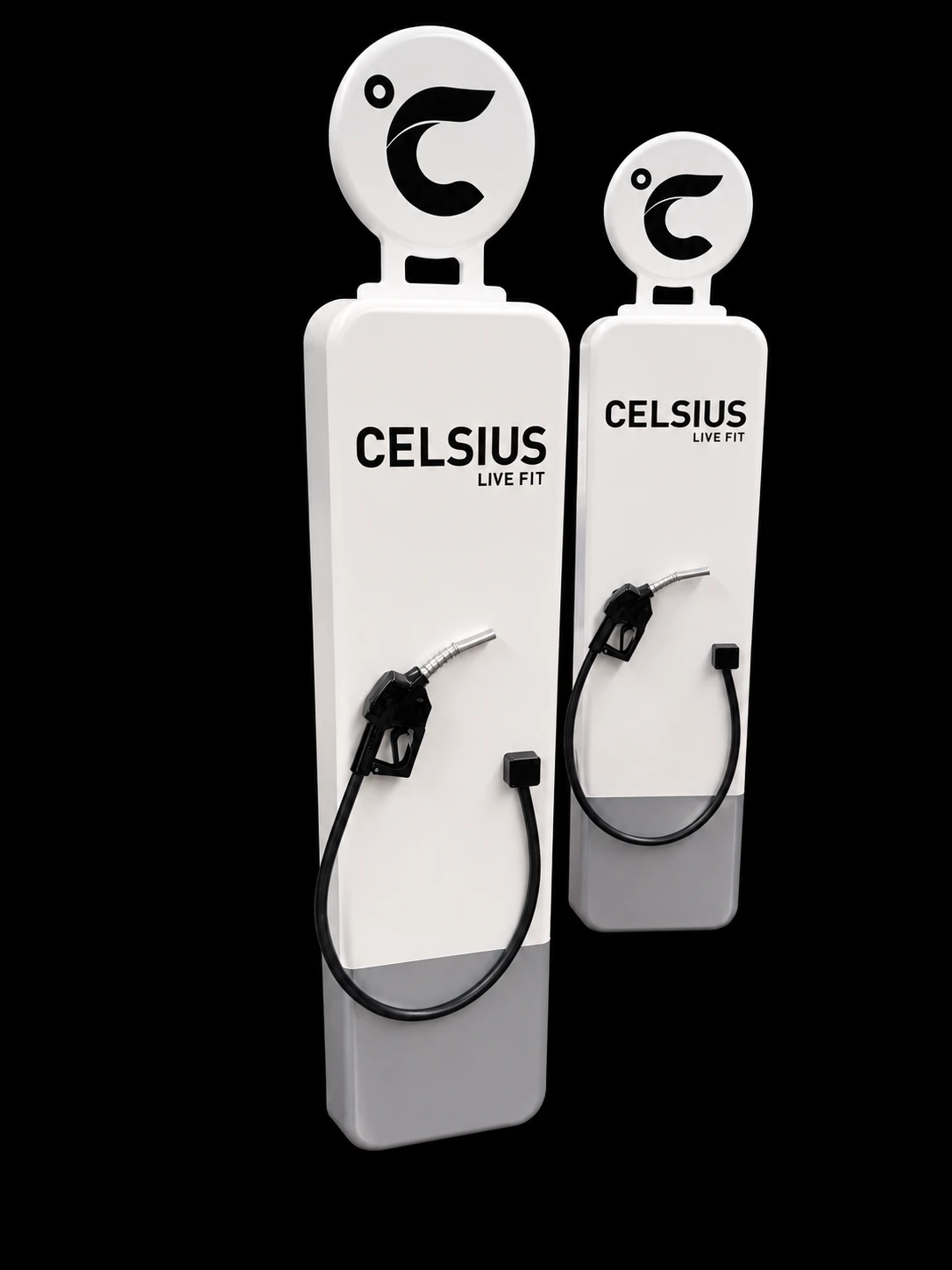 Two white Celsius Live Fit display props shaped like vintage fuel pumps, with hoses and nozzles