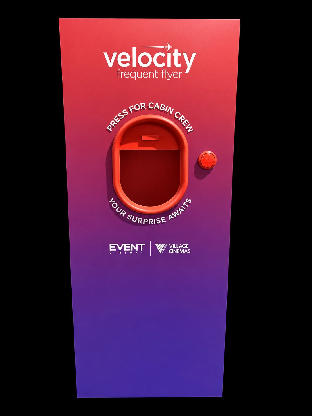 Red and purple Velocity Frequent Flyer display with an aircraft-window opening and red push button