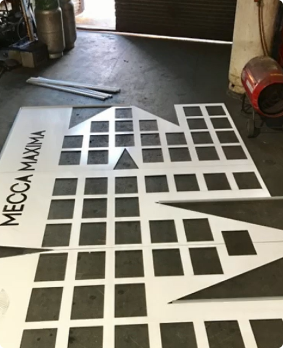 Custom-cut building facade panels in the DSS workshop
